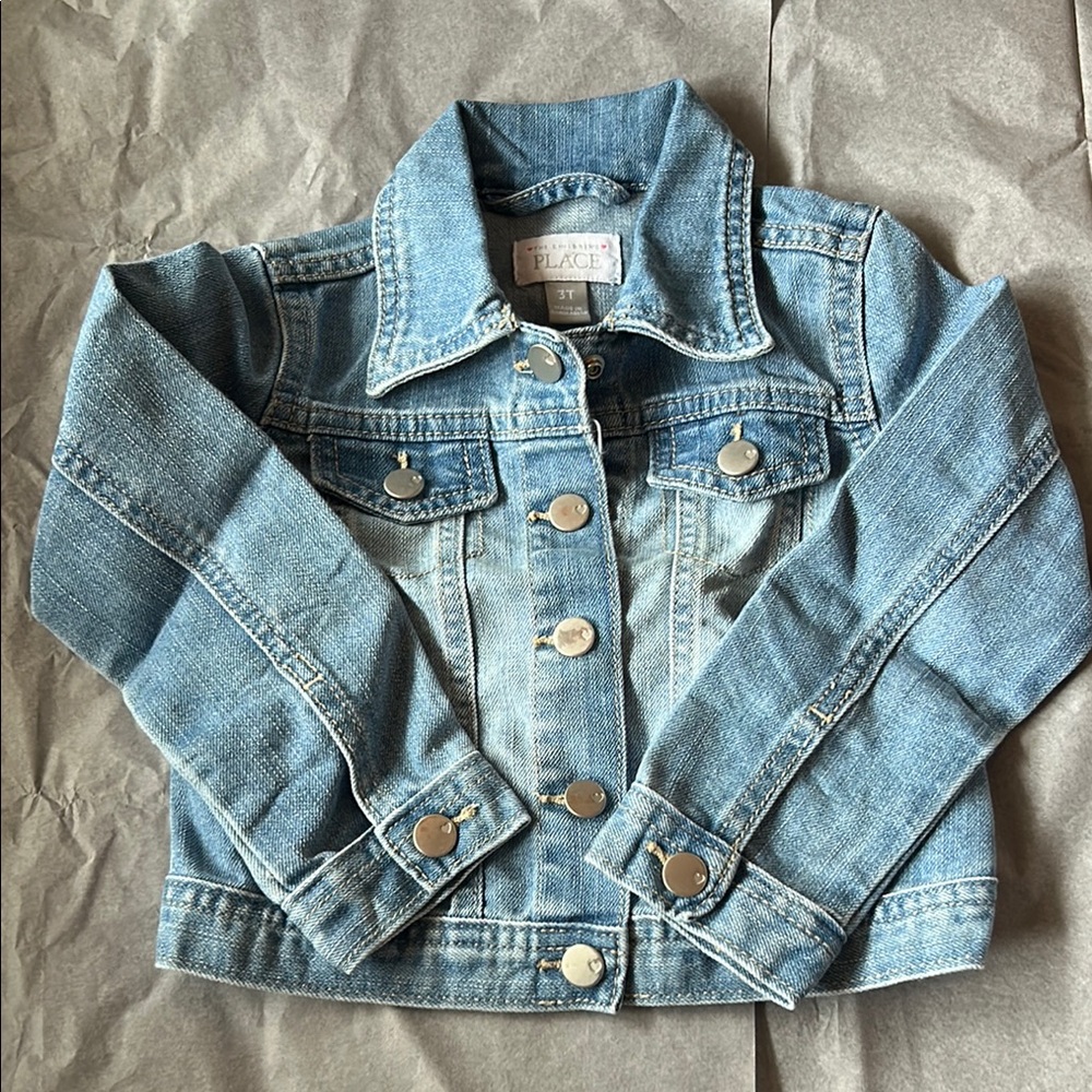 Light wash denim jacket with sliver heart stamped buttons